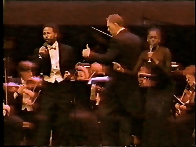 David Eaton conducting with Philip Michael Thomas and Mzuri. Manhattan Center, New York.